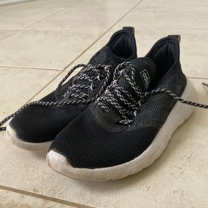 Black adidas running sneakers.